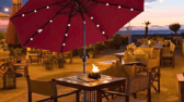 The Outsunny parasol with solar-powered LED lights creates a cosy and inviting glow for evening gatherings