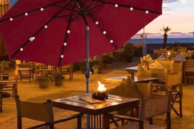 The Outsunny parasol with solar-powered LED lights creates a cosy and inviting glow for evening gatherings