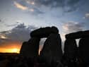 The sun rises over Stonehenge on the summer solstice, an event that attracted record crowds of druids, sun devotees, tourists and others (Picture: Finnbarr Webster)