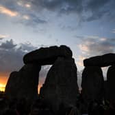 The sun rises over Stonehenge on the summer solstice, an event that attracted record crowds of druids, sun devotees, tourists and others (Picture: Finnbarr Webster)