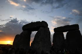 The sun rises over Stonehenge on the summer solstice, an event that attracted record crowds of druids, sun devotees, tourists and others (Picture: Finnbarr Webster)