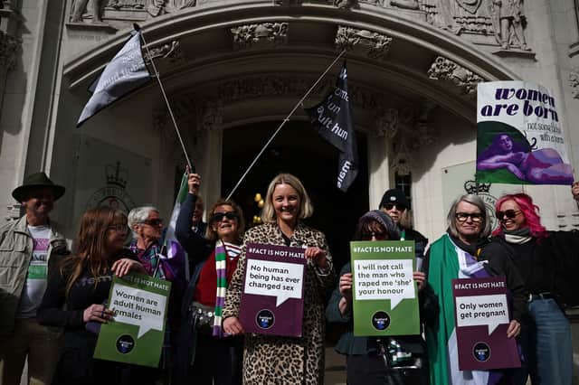 Campaigners celebrate the recent Supreme Court ruling about the definition of the word 'woman' (Picture: Henry Nicholls)