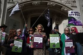 Campaigners celebrate the recent Supreme Court ruling about the definition of the word 'woman' (Picture: Henry Nicholls)