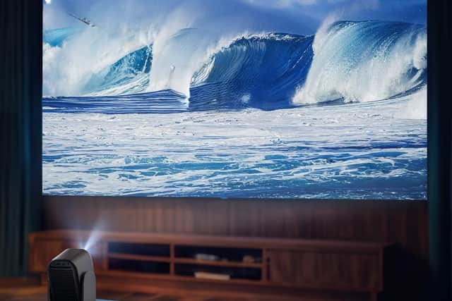 The beam can project out to 120 inches - but you'll need to be in low light for it to be at its best