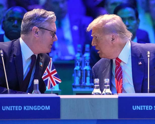 Keir Starmer speaks to US President Donald Trump at the Nato summit in The Hague (Picture: Kin Cheung/pool)
