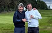 Edzell’s Will Bremner, right, receives The McAlpine - Scottish Mid Amateur Championship trophy from Hamish McAlpine after his play-off win at Alyth