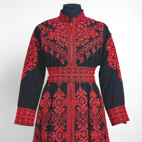 The embroidered dress lent by Nadia El-Nakla, worn at the swearing-in ceremony of her husband, Humza Yousaf as first minister.
