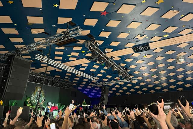 The crowd shine their phone torches as Stephen Wilson Jr plays Father's Søn at the Barrowlands Ballroom in Glasgow on 25 June