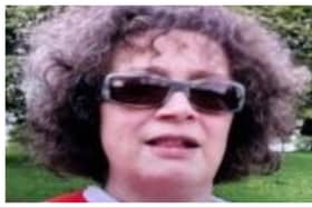 Emma Herdman is described as 5ft 9 in height, of medium build, with short dark brown curly hair.
