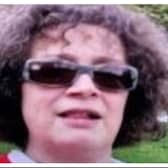 Emma Herdman is described as 5ft 9 in height, of medium build, with short dark brown curly hair.