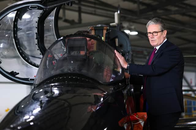 Keir Starmer is shown a fast-jet trainer during a visit to RAF Valley in Anglesey on Friday (Picture: Paul Currie)