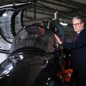 Keir Starmer is shown a fast-jet trainer during a visit to RAF Valley in Anglesey on Friday (Picture: Paul Currie)