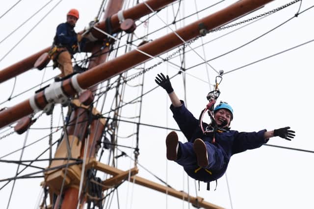 Lorraine Kelly abseils from the mast of the RRS Discovery at Discovery Point in Dundee (Picture: Andrew Milligan)