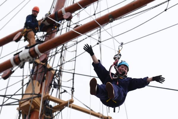 Lorraine Kelly abseils from the mast of the RRS Discovery at Discovery Point in Dundee (Picture: Andrew Milligan)