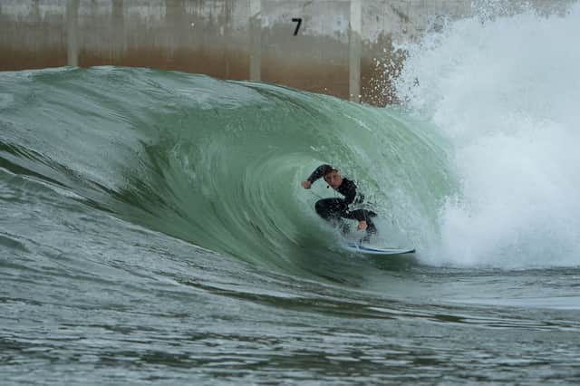 Scottish surfing champion Craig McLachlan, deep in the barrel at the Hi-Land Fling