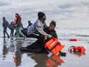 Migrants abandon a people-smugglers' boat after it was punctured with a knife by French police to stop them attempting to cross the English Channel from a beach at Gravelines, near Dunkirk (Picture: Sameer Al-Doumy)