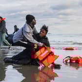 Migrants abandon a people-smugglers' boat after it was punctured with a knife by French police to stop them attempting to cross the English Channel from a beach at Gravelines, near Dunkirk (Picture: Sameer Al-Doumy)