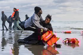Migrants abandon a people-smugglers' boat after it was punctured with a knife by French police to stop them attempting to cross the English Channel from a beach at Gravelines, near Dunkirk (Picture: Sameer Al-Doumy)