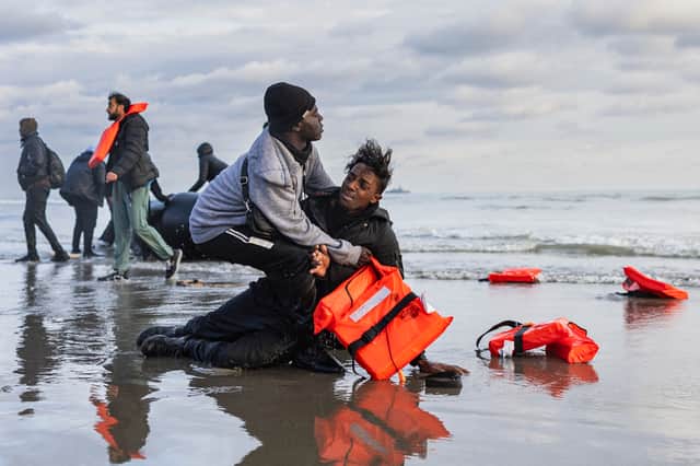 Migrants abandon a people-smugglers' boat after it was punctured with a knife by French police to stop them attempting to cross the English Channel from a beach at Gravelines, near Dunkirk (Picture: Sameer Al-Doumy)