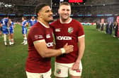 Finn Russell (R) and Sione Tuipulotu of the British & Irish Lions celebrate after their victory during the tour match against the Western Force at the Optus Stadium in Perth.