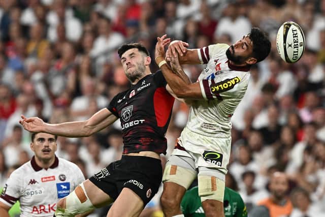 Toulouse's Blair Kinghorn fights for the ball with Bordeaux-Begles full-back Romain Buros during the French Top 14 final in Paris.