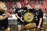 Blair Kinghorn, centre, celebrates with Toulouse team-mates Thibaud Flament, left, and Jack Willis and the Bouclier de Brennus trophy after winning the French Top 14  final against Bordeaux-Begles at the Stade de France.