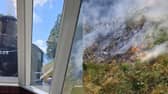 Wildfires burn near steam train full of passengers in Scotland.