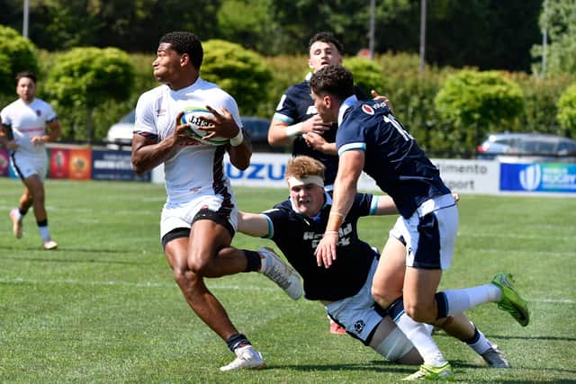 England's Tyler Offiah on the attack against Scotland during the World Rugby U20 Championship Pool A match at Payanini Center in Verona.