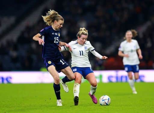 Scotland's Jenna Clark (left) and England's Lauren Hemp battle for the ball during the UEFA Women's Nations League Group A1 match at Hampden Park.