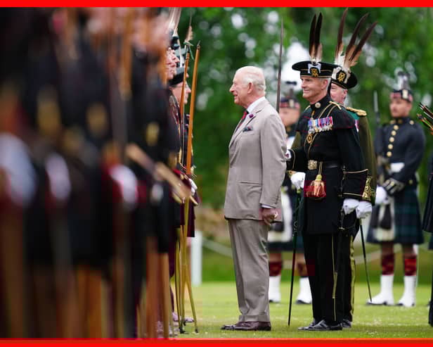 King Charles III speaks to a member of Royal Company of Archers, The King's Bodyguard Scotland, at the Ceremony of the Keys in the gardens of the Palace of Holyroodhouse in Edinburgh. Picture: Jane Barlow/PA Wire
