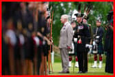 King Charles III speaks to a member of Royal Company of Archers, The King's Bodyguard Scotland, at the Ceremony of the Keys in the gardens of the Palace of Holyroodhouse in Edinburgh. Picture: Jane Barlow/PA Wire