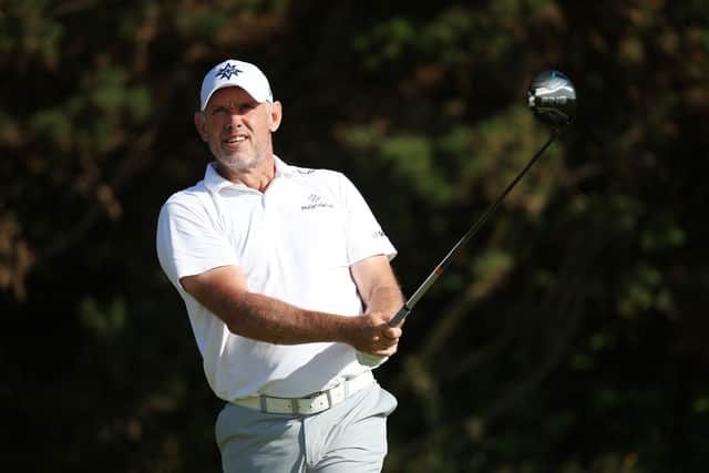 Lee Westwood watches a tee shot in the first round at Dundonald Links