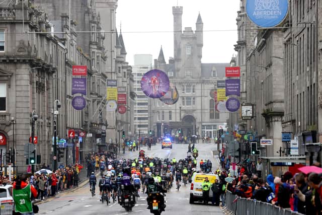 The peloton make their way through Aberdeen's Union Street during stage one of the AJ Bell Tour of Britain. Picture: PA