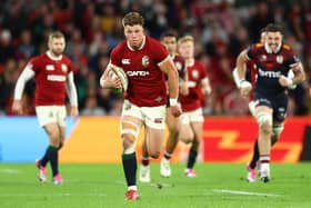 Huw Jones of the British & Irish Lions makes a break and scores a try during the victory over Queensland Reds at Suncorp Stadium in Brisbane, Australia. (Photo by Chris Hyde/Getty Images)