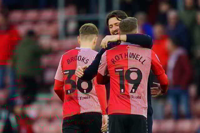 Southampton manager Russell Martin celebrates a victory with Joe Rothwell after the final whistle.
