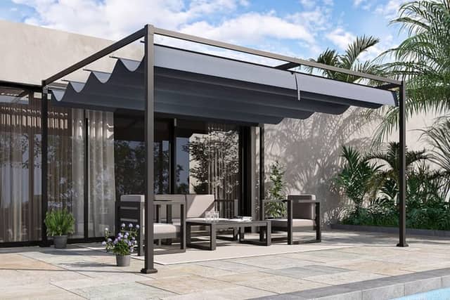 The pergola has a full-length retractable canopy to keep the sun off you