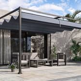 The pergola has a full-length retractable canopy to keep the sun off you
