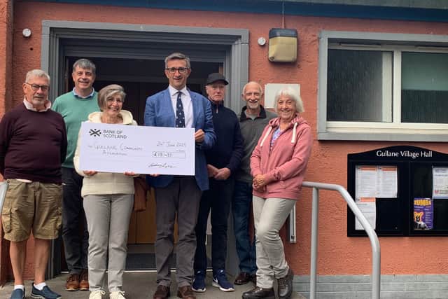 Gullane Golf Club captain Colin Steele presents his Charity Day cheque to representatives of Gullane Community Association