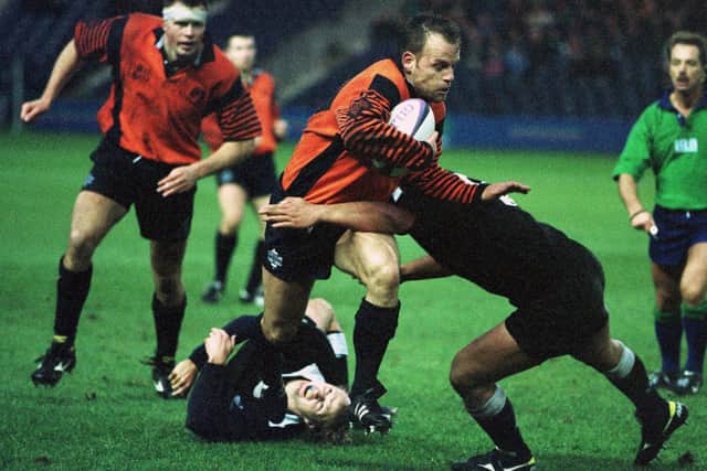 Scotland's Rowen Shepherd seeks a way past Maori opponent Adrian Cashmore during at 1998 match at Murrayfield.
