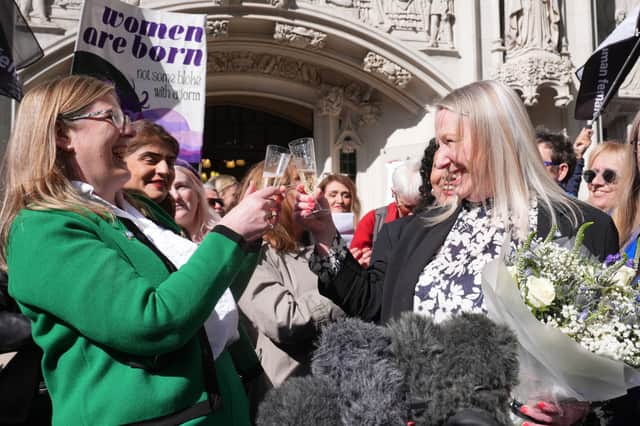 Members of For Women Scotland celebrate the Supreme Court ruling that the word 'woman' the 2010 Equality Act refers to a biological woman (Picture: Lucy North)