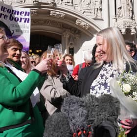 Members of For Women Scotland celebrate the Supreme Court ruling that the word 'woman' the 2010 Equality Act refers to a biological woman (Picture: Lucy North)