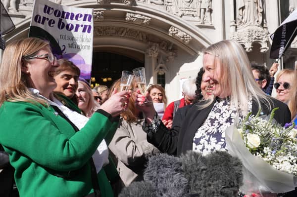 Members of For Women Scotland celebrate the Supreme Court ruling that the word 'woman' the 2010 Equality Act refers to a biological woman (Picture: Lucy North)