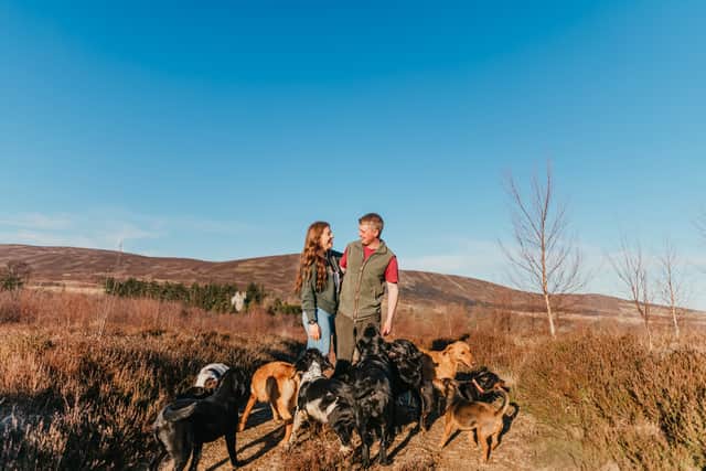 Molly, a veterinary nurse with Calum, a gamekeeper, and their dogs