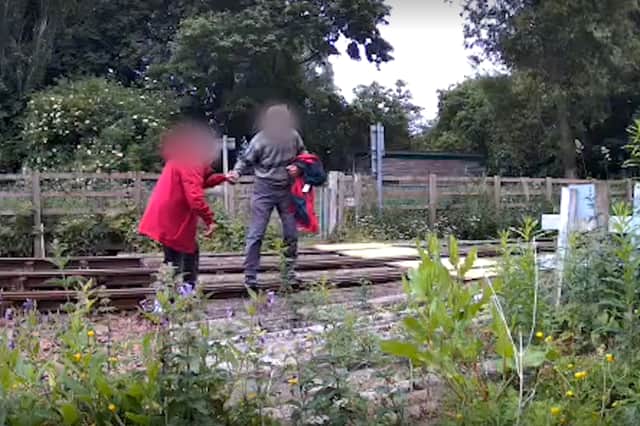 Members of the public cross the River Peffery via the railway bridge between Dingwall Canal South and North level crossings.