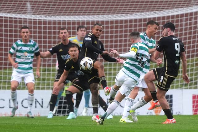 Callum McGregor has a shot at goal during Celtic's match against Queen's Park.