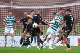 Callum McGregor has a shot at goal during Celtic's match against Queen's Park.