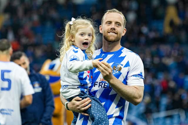 Kilmarnock's Rory McKenzie with family at full time during his testimonial match.