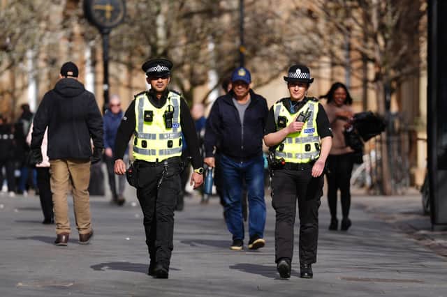 Most police officers join the force because they want to make their communities better and safer places (Picture: Andrew Milligan)