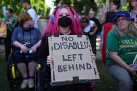 People protest against Labour's plan to cut disability benefits, which was gutted after a major backbench rebellion against it (Picture: Carl Court)