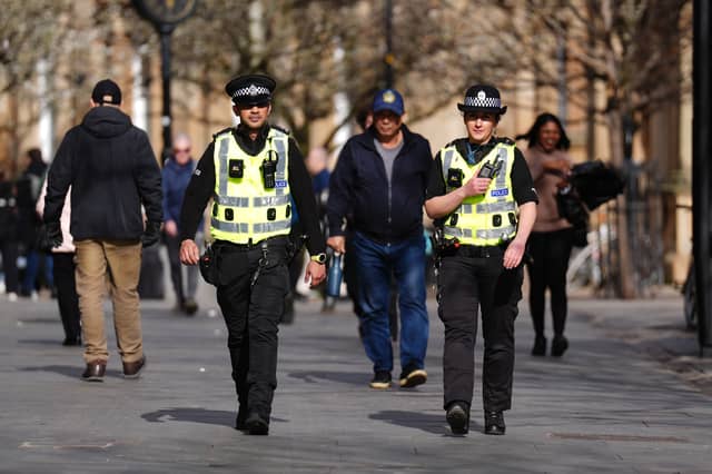 Most police officers join the force because they want to make their communities better and safer places (Picture: Andrew Milligan)